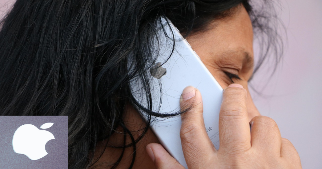 mulher de aproximadamente 40 anos telefonando pelo Iphone