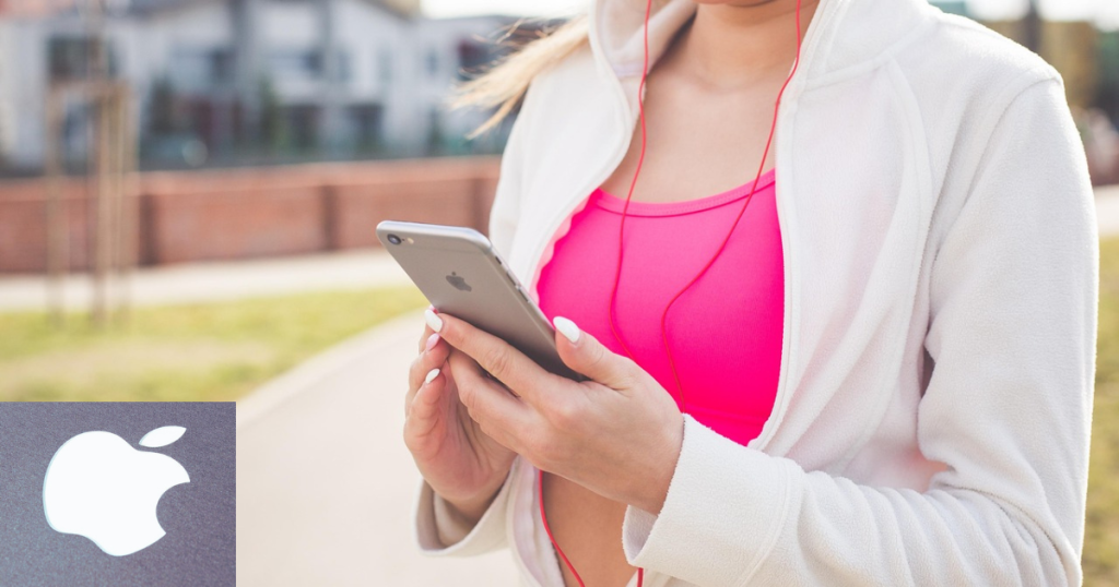 mulher correndo usando Iphone para escutar músicas